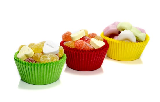 sweet candy cupcakes in yellow red and green