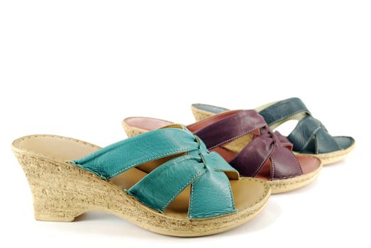 Woman green red and black sandals on white