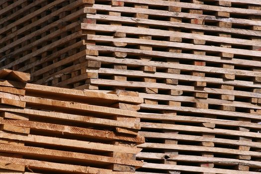 Freshly cut lumber stacked to dry in an outdoor sawmill in Cotacachi, Ecuador