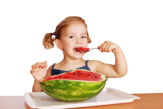 Beauty little girl eating watermelon studio shot