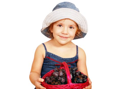 Beauty little girl holding basket with grape studio shot