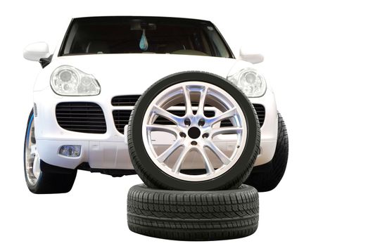 Car aluminum wheel and 4x4 suv isolated on white