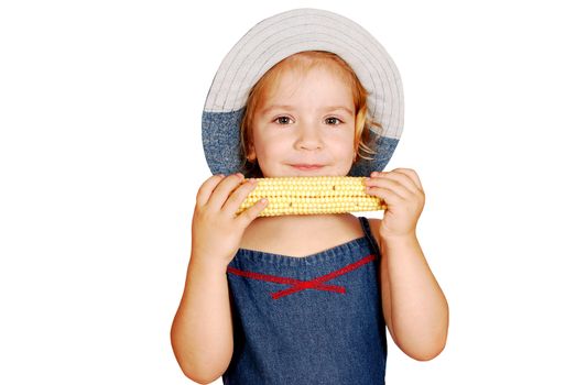 Little girl eating corn studio shot