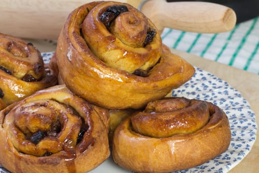 A Freshly baked plate of fruity Chelsea buns