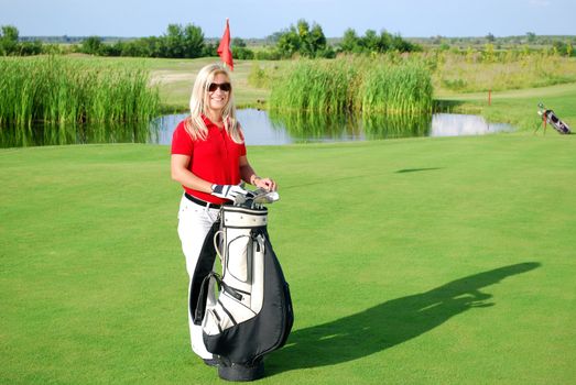 Beauty girl posing on golf field