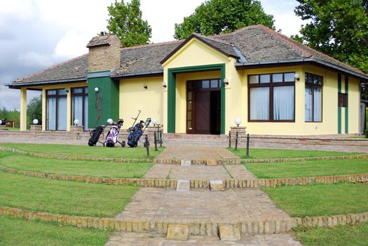 Golf club house with golf bag