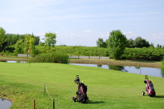Golf field with two golf bag