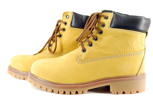 Yellow hiking boots studio shot