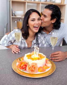 Romantic couple celebrating in the kitchen