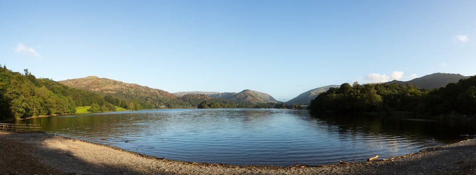 Panorama of Grasmere in Lake District as sunrise as sun light mountains