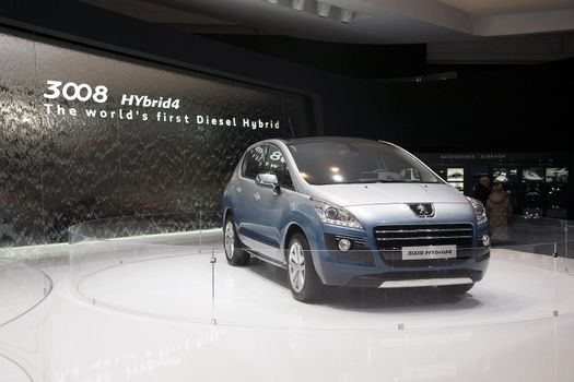 GENEVA, SWITZERLAND - MARCH 4, 2011 - Peugeot 3008 Hybrid4 is presented at the annual motor show in Geneva on March 4, 2011.  This is the world's first diesel hybrid vehicle.
Photo: Sami Haqqani / yaymicro.com.