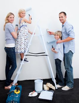 Happy Family decorating their new home together
