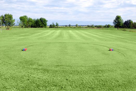 Green grass golf field tee area