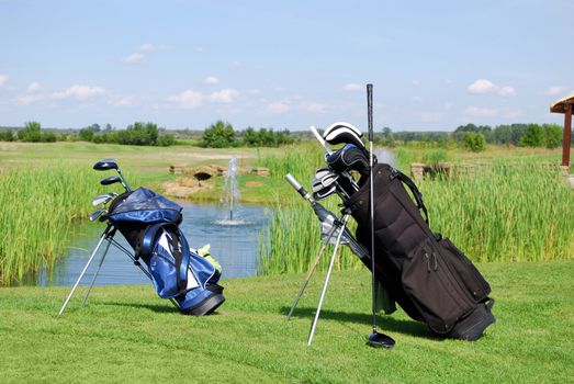 Two golf bags on golf field