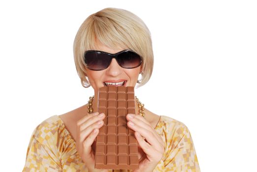 Woman eat large chocolate studio shot