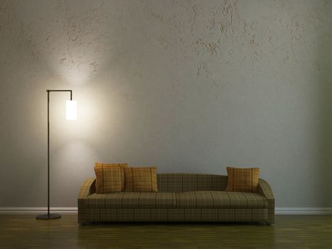 Sofa and a lamp near the wall