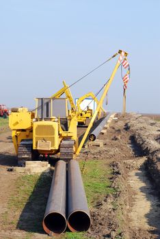 Construction site with gas pipeline and heavy machinery