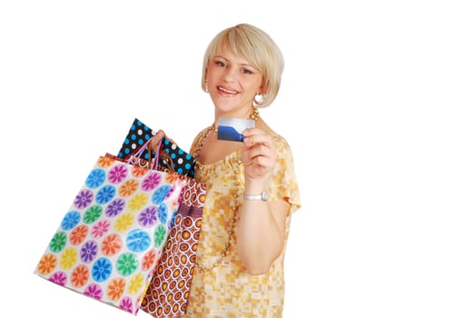 Woman with credit card and shopping bags studio shot