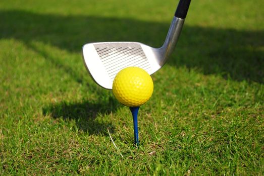 Yellow golf ball and golf club