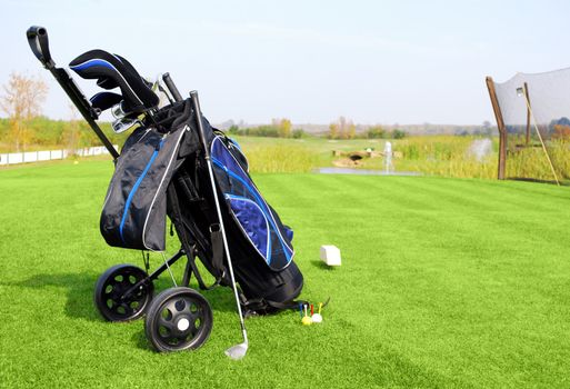 Golf field with blue golf bag