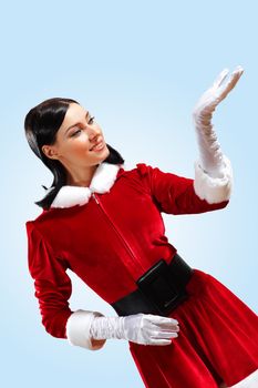 Santa Girl presenting your product, in costume and white gloves