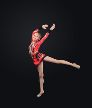 Young cute woman in gymnast suit show athletic skill on black background