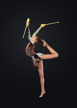 Young cute woman in gymnast suit show athletic skill on black background