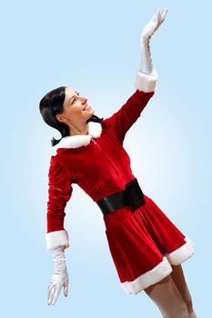 Santa Girl presenting your product, in costume and white gloves