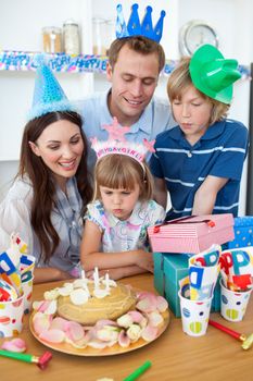 Cute little girl celebrating her birthday in the kitchen