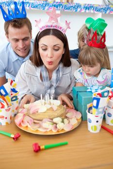 Brunette mother celebrating her birthday in the kitchen