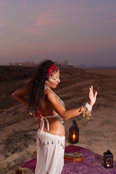 Expressive oriental dance outdoors at evening time