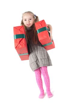 Beautiful girl standing with christmas presents on white