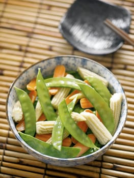 close up of a bowl of stir fried vegetables