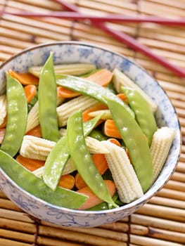 close up of a bowl of stir fried vegetables