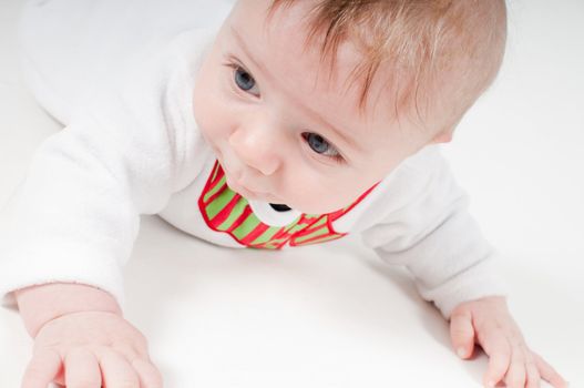 Closeup portrait of baby in snowman costume on light background