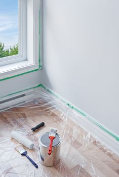 Renovations. Painting tools and floor protected by plastic.