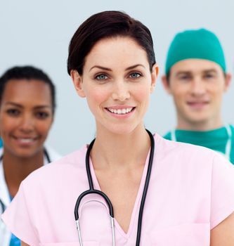 Female Doctor standing in Front of her team in the hospital