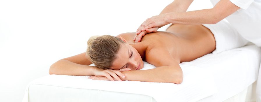 Attractive woman being massaged in a hotel