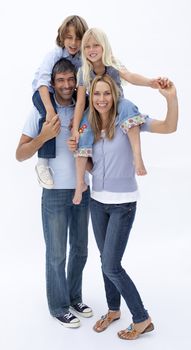 Happy family giving children piggy back ride against white background