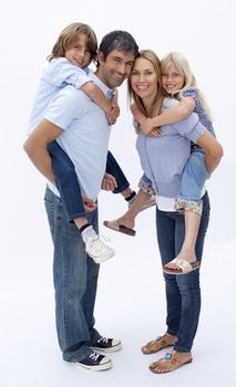 Family giving children piggy back ride against white background