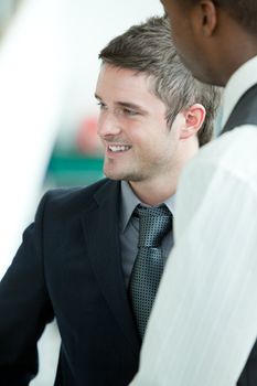 Business men talking in an office