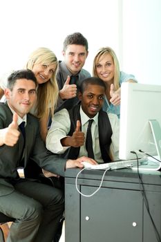 International business team working in office with thumbs up