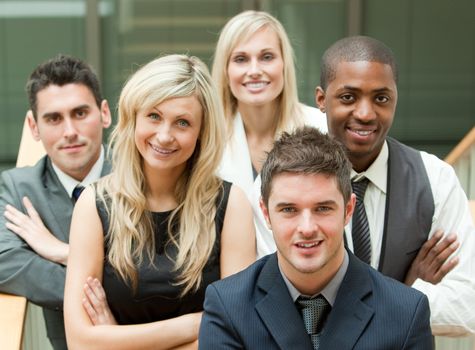 Businesspeople in a stairs with the leader in the middle