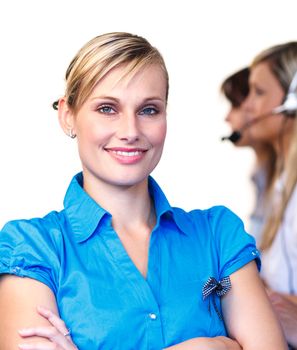 Beautiful businesswoman smiling at the camera in a call center 