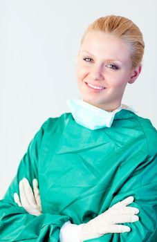 Young Female Surgeon with her mask off smiling at the camera