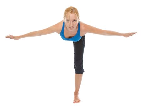 Practicing Yoga. Young woman isolated on white background