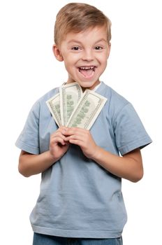 Portrait of a cheerful little boy holding a dollars over white background