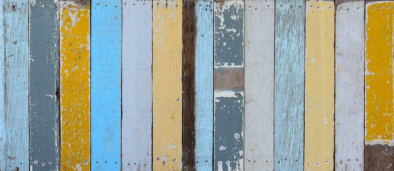 The old painted wooden wall with  variety color.