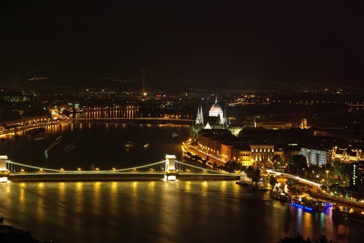 Night view in Budapest: Danube river, Chain bridge and Parliament