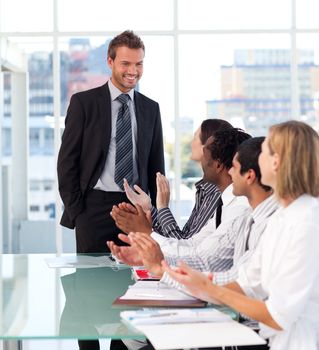 International business team applauding his colleague